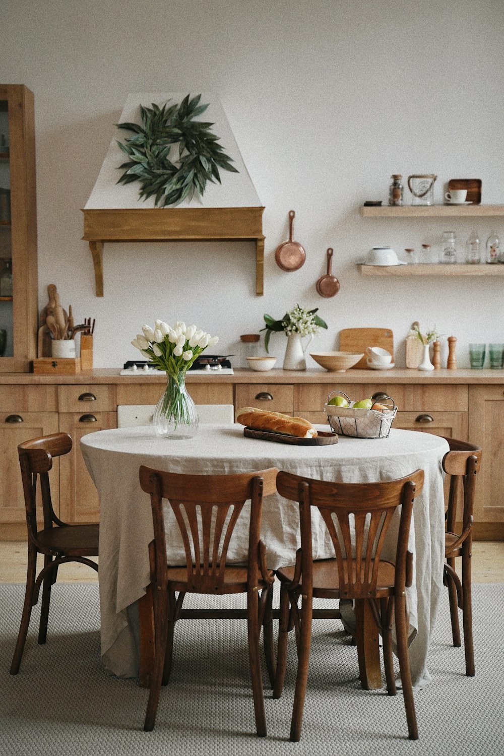 A warm kitchen with a wooden dining table